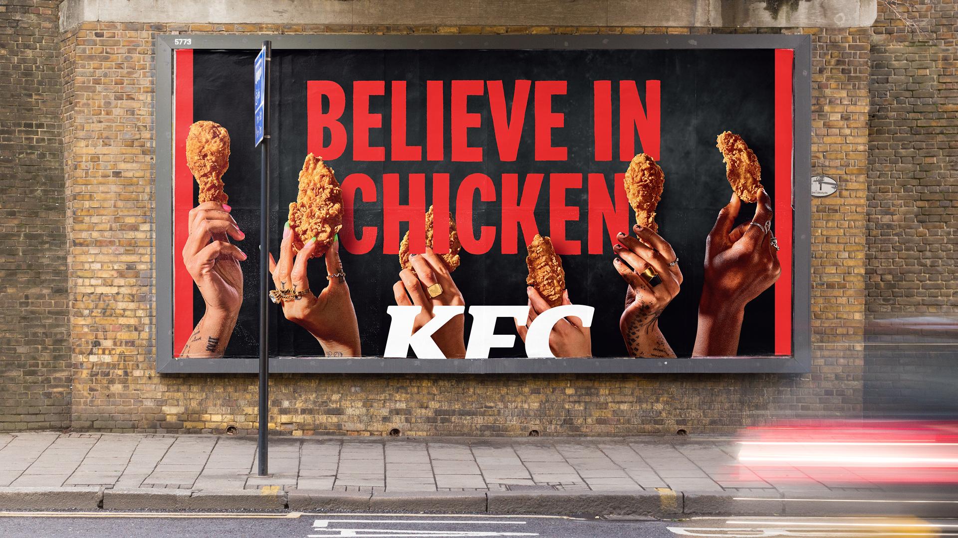 An image of a KFC poster with their new advert: "Believe In Chicken". Showing multiple hands holding up chicken wings from KFC.